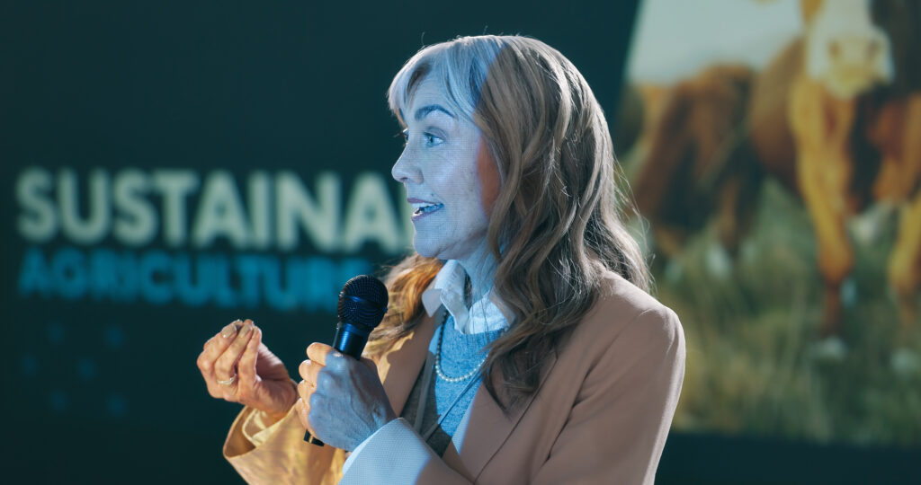 conference-mature-woman-and-speaker-on-stage